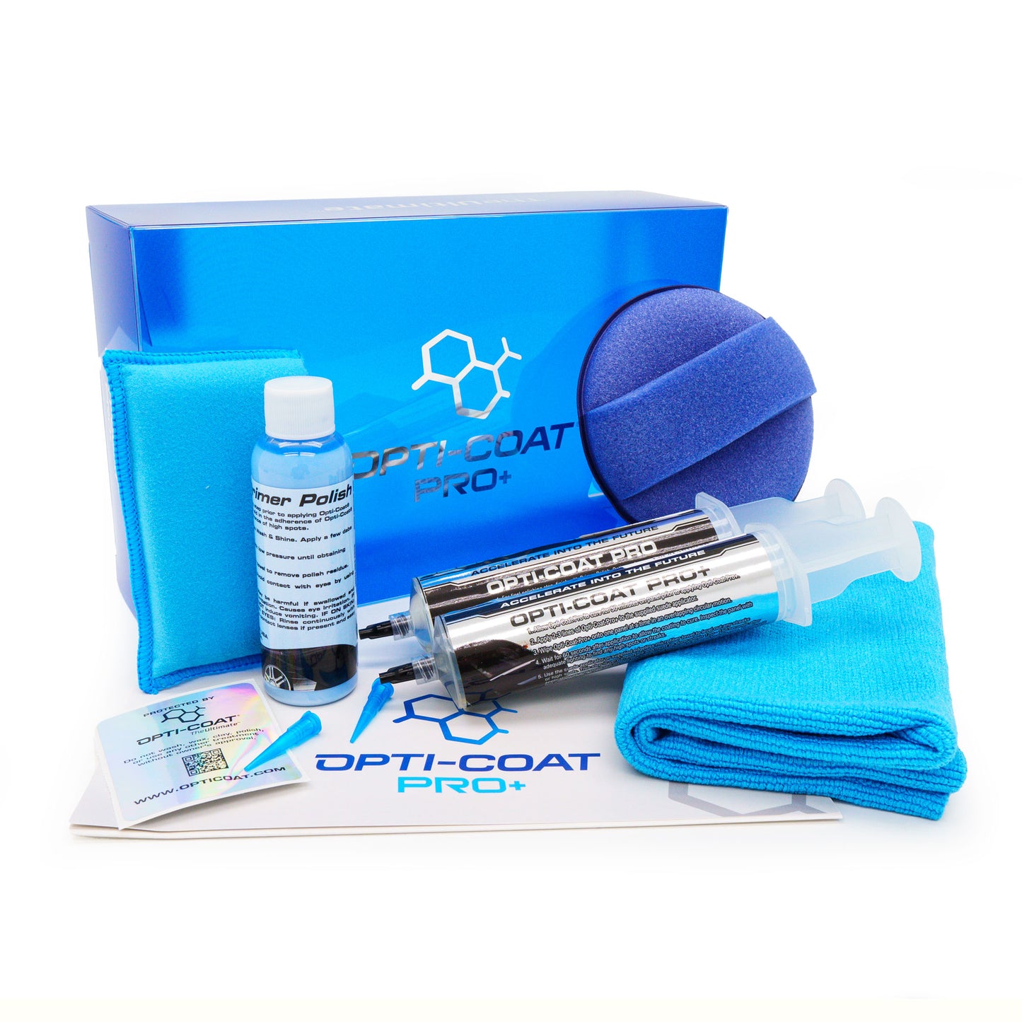 Product photography of the Opti-Coat Pro+ car ceramic coating kit on a white background, displaying a bright blue box, two syringe-style applicators, a light blue primer polish bottle, and blue microfiber cloths with the brand's chemical structure logo